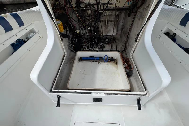 Slide: The Image of Storage compartment with ropes on a 1993 Marlin 35 CC Sportfish boat. - 68