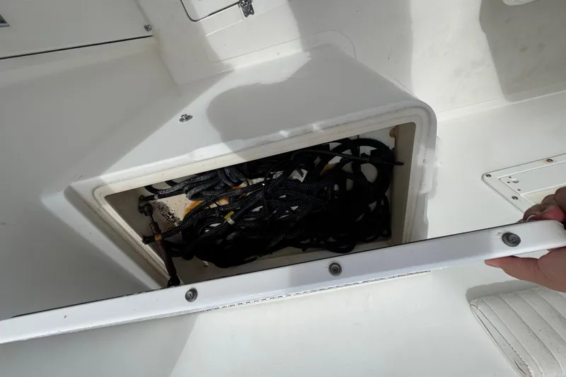 Slide: The Image of 1993 Marlin 35 CC Sportfish boat interior with open storage compartment. - 69