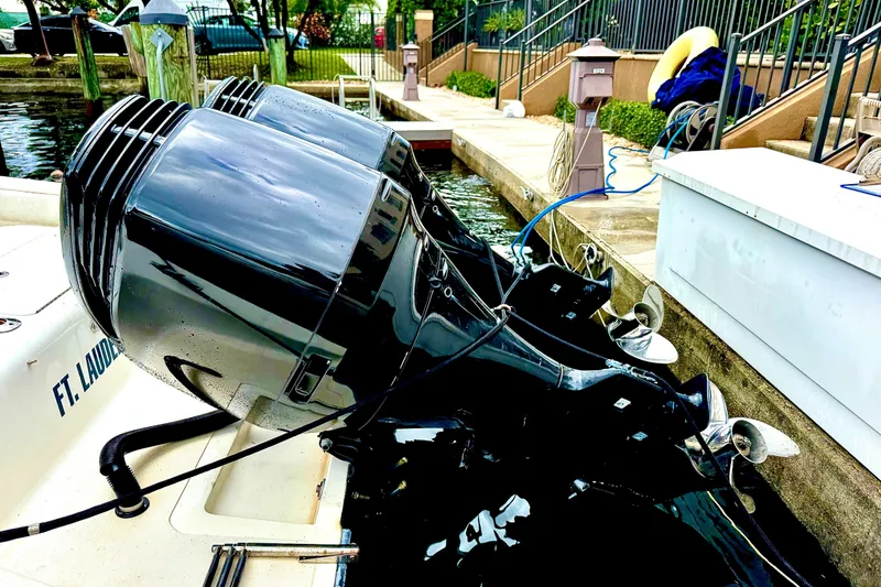 Slide: The Image of 1993 Marlin 35 CC Sportfish boat interior with seating and storage, docked by water. - 7