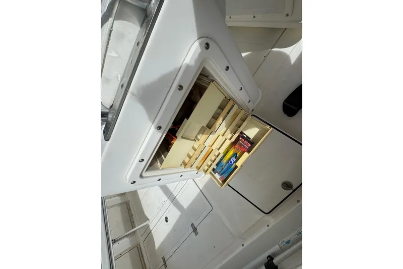 Slide: The Image of Storage area in a 1993 Marlin 35 CC Sportfish with life jackets and safety equipment. - 70