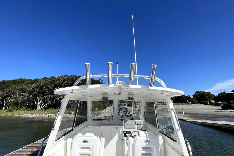 Slide: The Image of 2024 NorthCoast 235 boat docked under clear blue sky. - 18