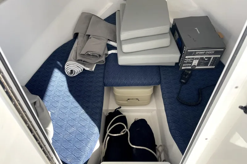 Slide: The Image of Interior cabin of 2024 NorthCoast 235 boat with cushions and GPS equipment. - 7