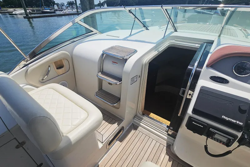 Slide: The Image of 2006 Chris-Craft Corsair 36 boat interior with seating and cabin entrance. - 10