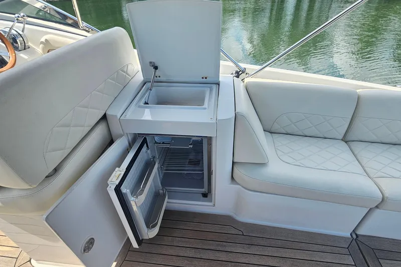 Slide: The Image of Luxurious 2006 Chris-Craft Corsair 36 boat interior with sink and mini fridge. - 11