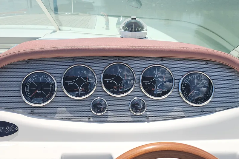 Slide: The Image of Dashboard of 2006 Chris-Craft Corsair 36 boat with gauges and compass. - 12
