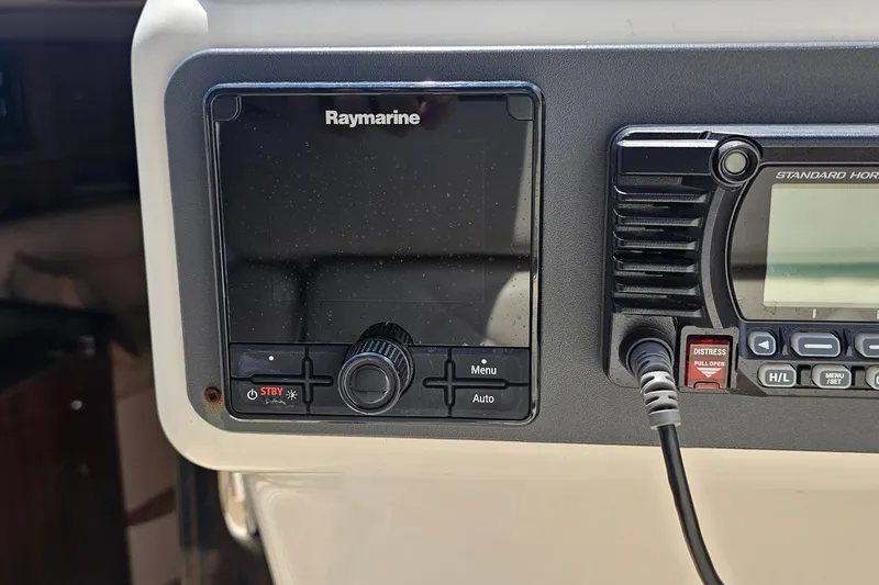 Slide: The Image of Raymarine and Standard Horizon equipment on 2006 Chris-Craft Corsair 36 dashboard. - 14