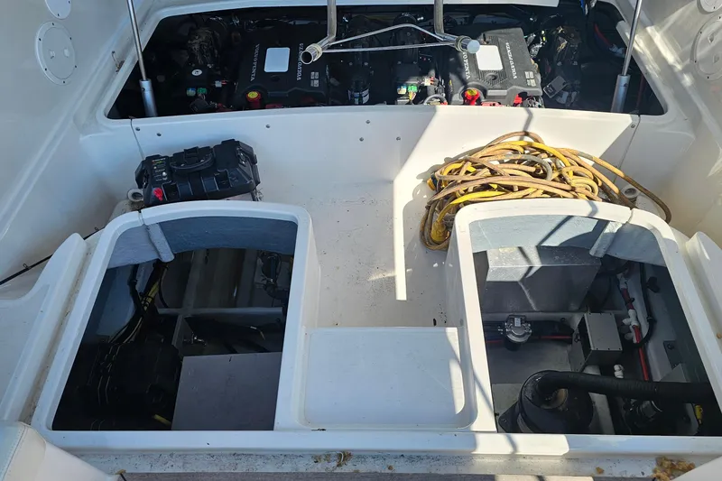 Slide: The Image of Engine compartment of 2006 Chris-Craft Corsair 36 with visible wiring and components. - 17