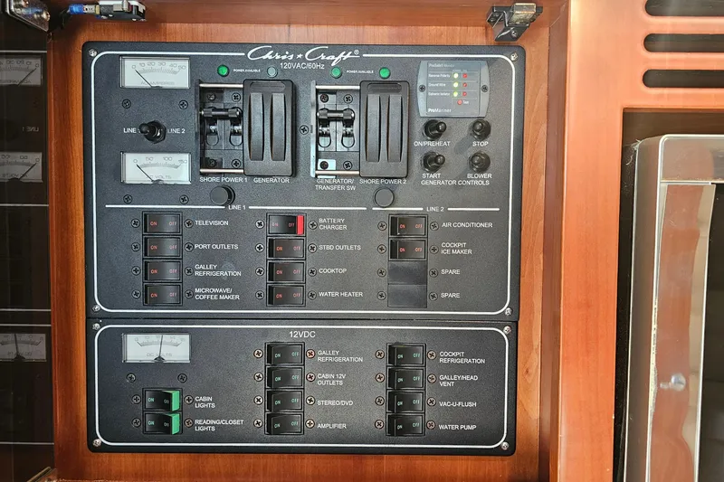 Slide: The Image of Electrical control panel of a 2006 Chris-Craft Corsair 36 boat, featuring various switches. - 27