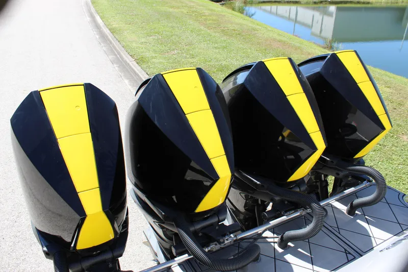 Slide: The Image of Four yellow and black outboard motors on a 2021 Mystic M4200 boat. - 20
