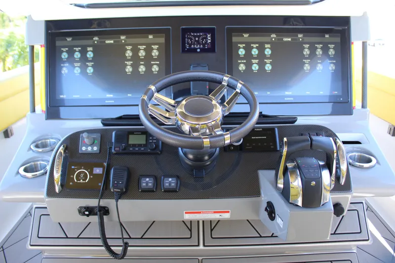 Slide: The Image of Cockpit of 2021 Mystic M4200 boat with advanced navigation and control systems. - 34