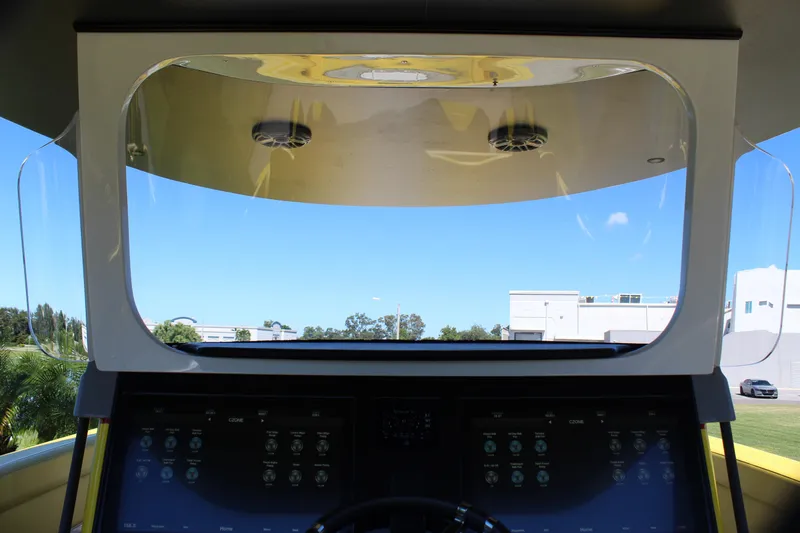 Slide: The Image of Interior view of 2021 Mystic M4200 boat cockpit with digital controls and clear windshield. - 37