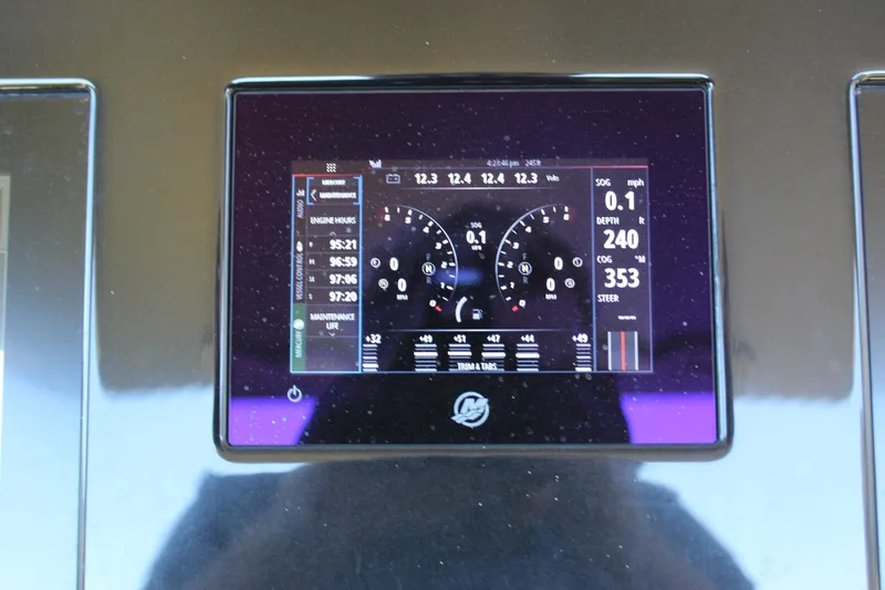 Slide: The Image of Dashboard display of a 2021 Mystic M4200 boat showing engine and navigation data. - 38