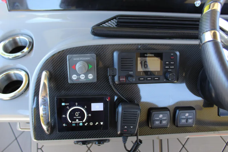 Slide: The Image of Control panel of a 2021 Mystic M4200 boat with Garmin navigation system. - 39