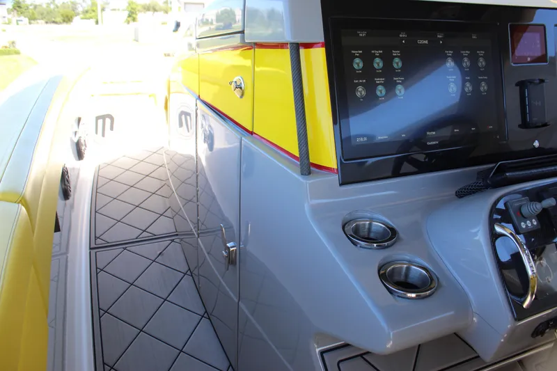 Slide: The Image of 2021 Mystic M4200 boat interior with touchscreen controls and sleek design. - 42