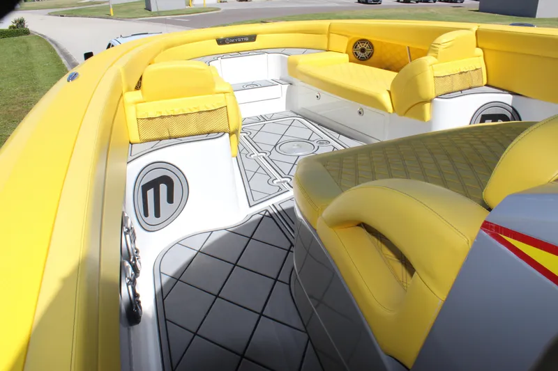 Slide: The Image of Yellow interior of 2021 Mystic M4200 boat with stylish seating and flooring. - 44