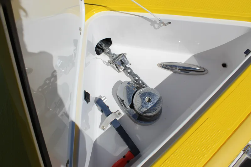 Slide: The Image of Anchor compartment of 2021 Mystic M4200 boat with chain and winch. - 48