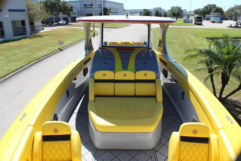 Slide: The Image of Yellow Mystic M4200 boat interior, 2021 model, featuring luxurious seating and modern design. - 51