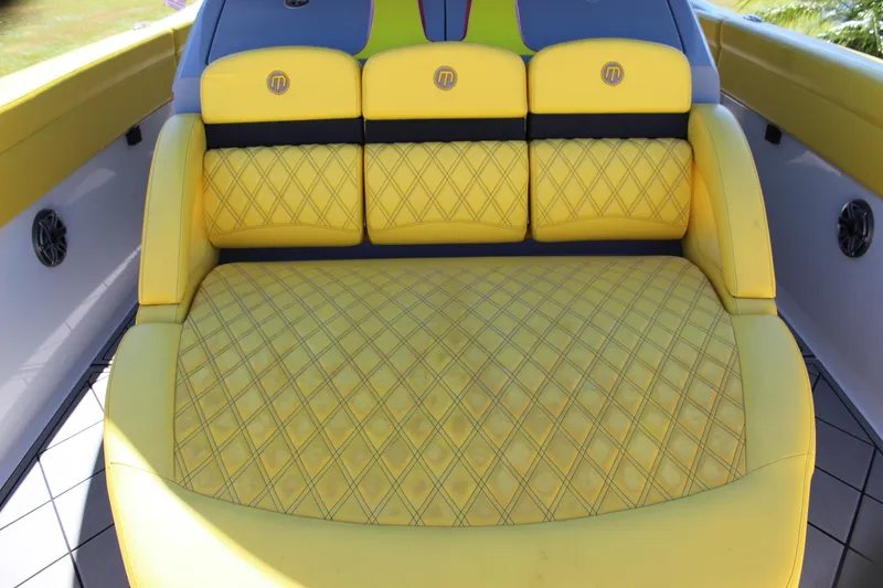 Slide: The Image of Yellow quilted seating on 2021 Mystic M4200 boat, featuring stylish design and comfort. - 52