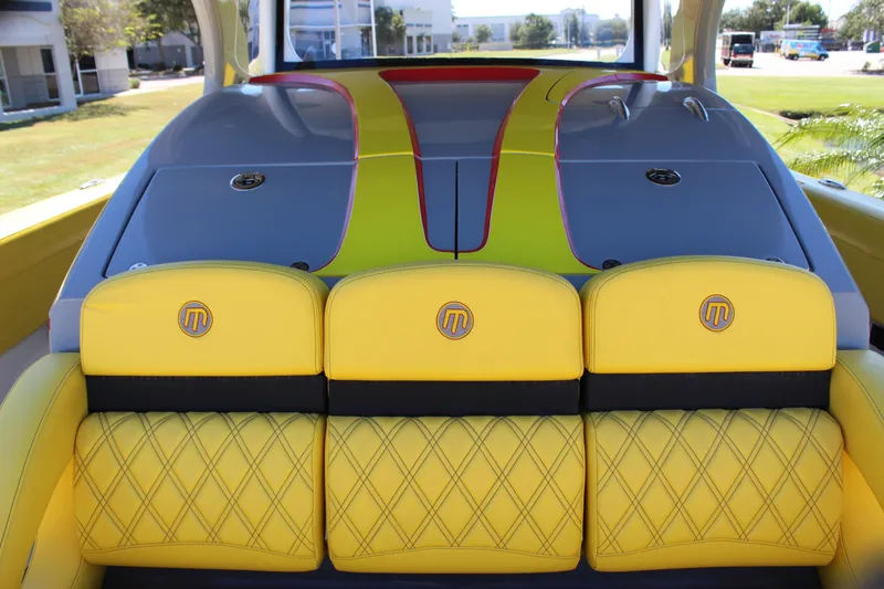 Slide: The Image of Yellow and gray interior of 2021 Mystic M4200 boat with quilted seats. - 53