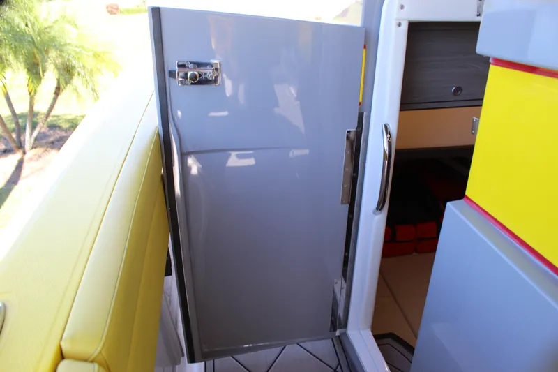 Slide: The Image of Open cabin door on 2021 Mystic M4200 boat, featuring sleek design and vibrant colors. - 56