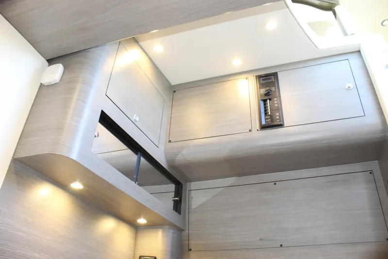 Slide: The Image of Modern interior of 2021 Mystic M4200 boat with sleek cabinetry and recessed lighting. - 60