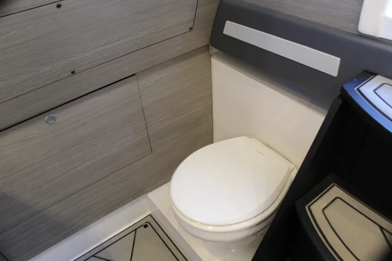 Slide: The Image of Modern bathroom interior in 2021 Mystic M4200 boat, featuring sleek design and compact toilet. - 61