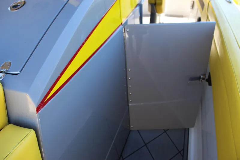 Slide: The Image of Yellow and gray interior of 2021 Mystic M4200 boat with open door. - 64