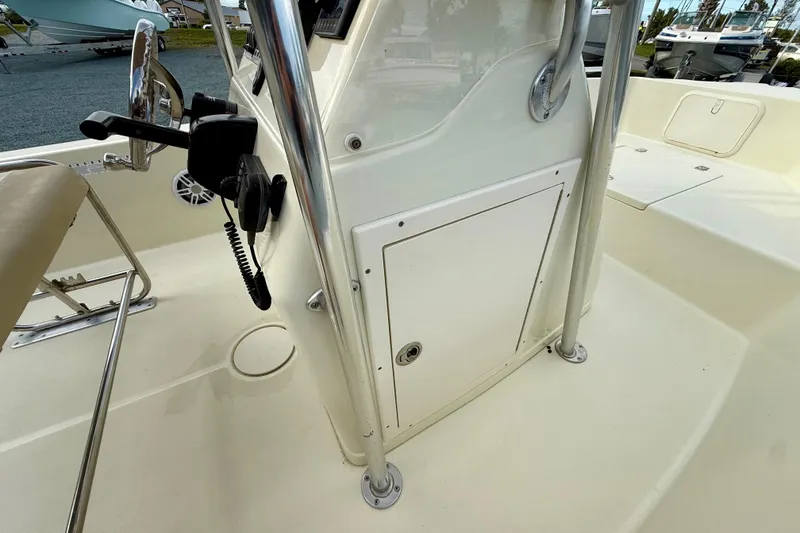 Slide: The Image of 2016 Release 180 CC boat console with steering wheel and radio equipment. - 24