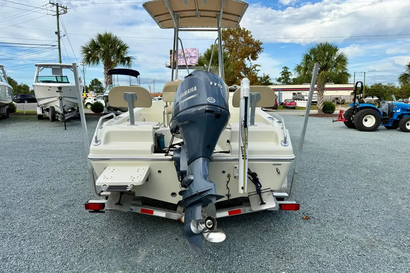 Slide: The Image of 2016 Release 180 CC boat with Yamaha outboard motor, parked on gravel lot. - 3