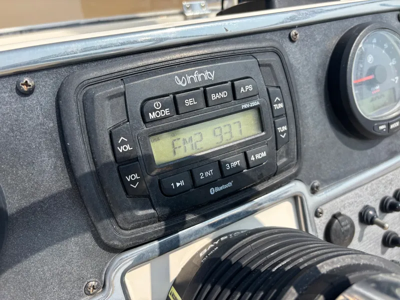 Slide: The Image of Infinity radio display on 2022 Scout 210 Dorado boat dashboard, tuned to FM 93.7. - 30