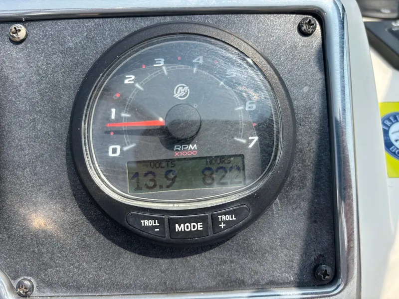 Slide: The Image of Close-up of a 2022 Scout 210 Dorado boat tachometer displaying RPM, volts, and hours. - 31
