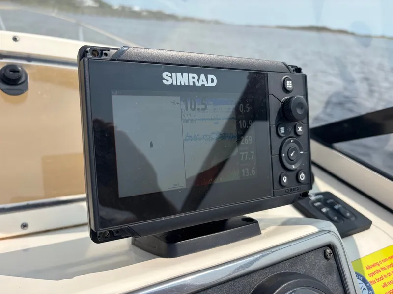 Slide: The Image of Simrad display on 2022 Scout 210 Dorado boat, showing navigation data. - 33