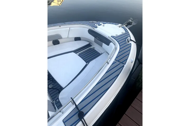 Slide: The Image of 2021 Robalo R242 Center Console boat for sale on trailer, sunny day. - 2
