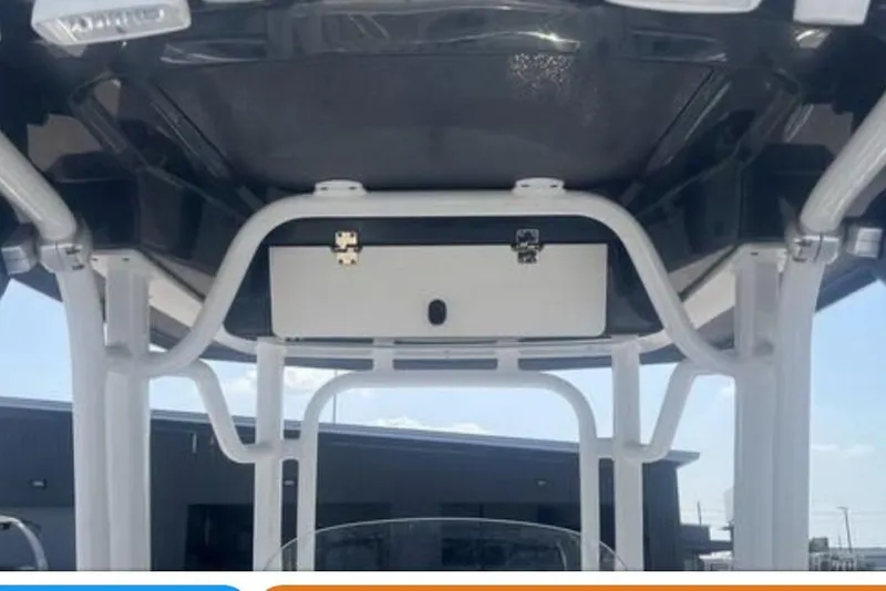 Slide: The Image of 2021 Robalo R242 Center Console boat interior with Garmin navigation system and stylish seating. - 6