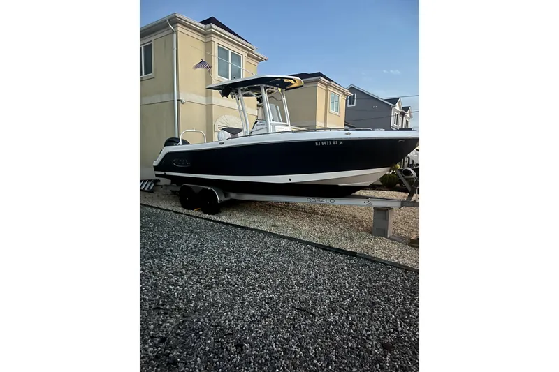 Slide: The Image of 2021 Robalo R242 Center Console boat interior with Garmin navigation system. - 7