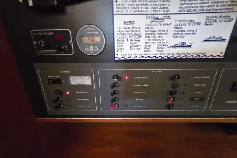 Slide: The Image of 1988 Pearson 362 Centerboard cabin interior with wooden doors and compact storage space. - 17