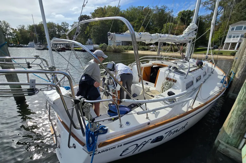 Slide: The Image of 1988 Pearson 362 Centerboard sailboat docked on shimmering water. - 2