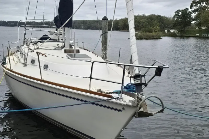 Slide: The Image of Interior of 1988 Pearson 362 Centerboard sailboat with wooden cabinetry and compact kitchen. - 3