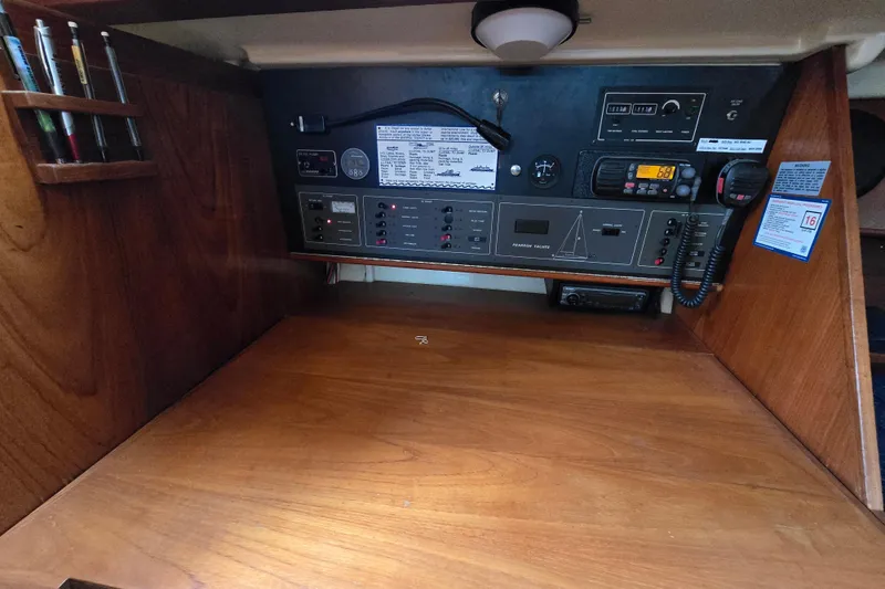 Slide: The Image of 1988 Pearson 362 Centerboard sailboat docked in a serene marina setting. - 8