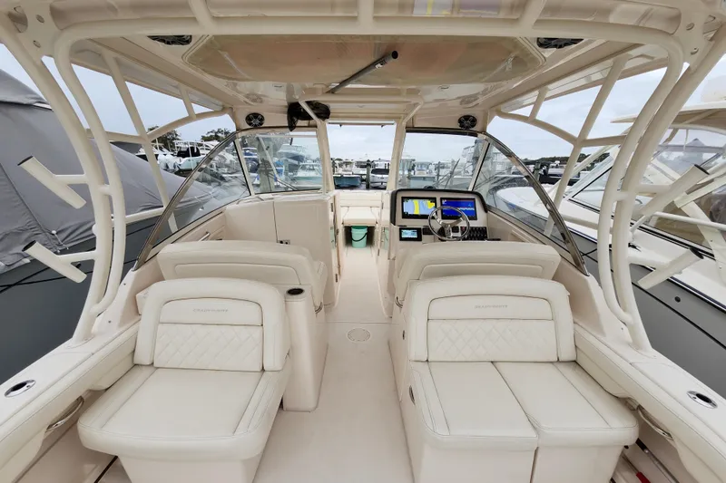 Slide: The Image of 2022 Grady-White Freedom 325 boat interior with luxurious seating and modern dashboard. - 15