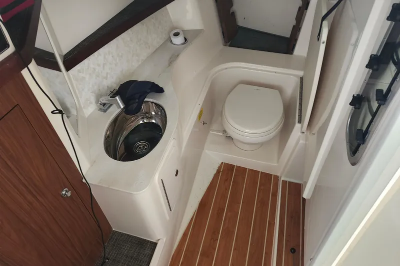 Slide: The Image of 2022 Grady-White Freedom 325 boat interior with toilet and sink. - 16
