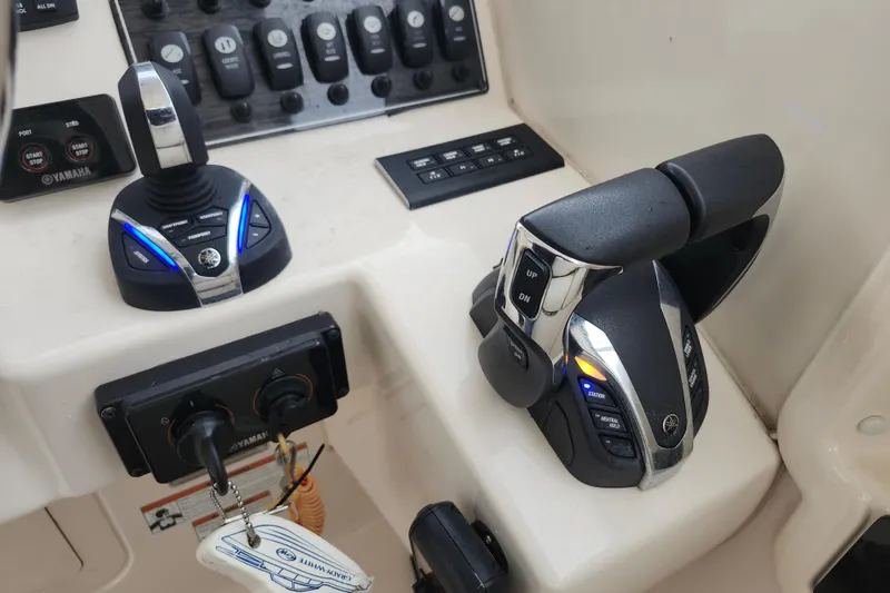 Slide: The Image of Control panel of 2022 Grady-White Freedom 325 boat with Yamaha throttle and joystick. - 7