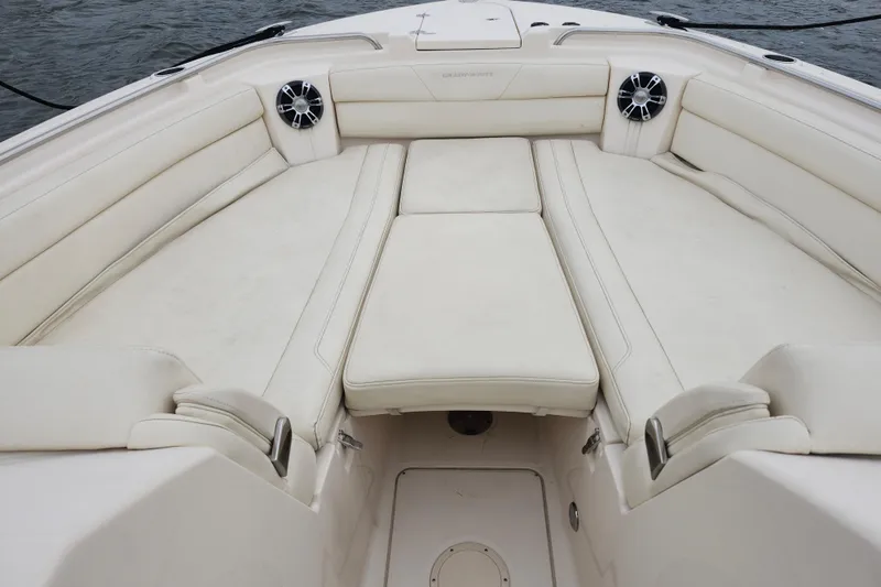 Slide: The Image of 2022 Grady-White Freedom 325 boat interior with white cushioned seating. - 9