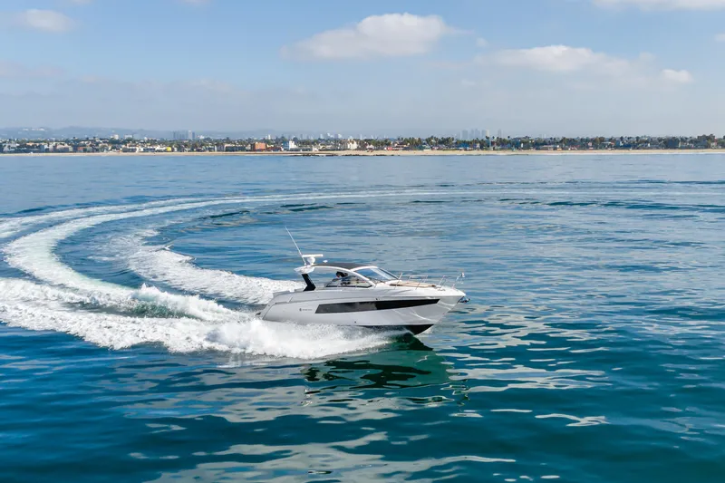 Slide: The Image of 2017 Cruisers Yachts 39 Express Coupe cruising on calm ocean waters. - 18