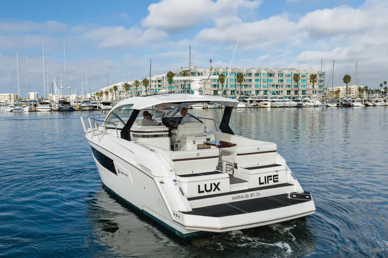 Slide: The Image of 2017 Cruisers Yachts 39 Express Coupe in marina, sunny day, luxury boating. - 19