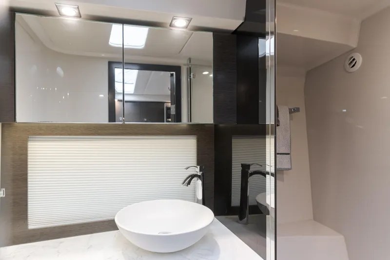 Slide: The Image of Luxurious bathroom interior of 2017 Cruisers Yachts 39 Express Coupe with modern fixtures. - 44