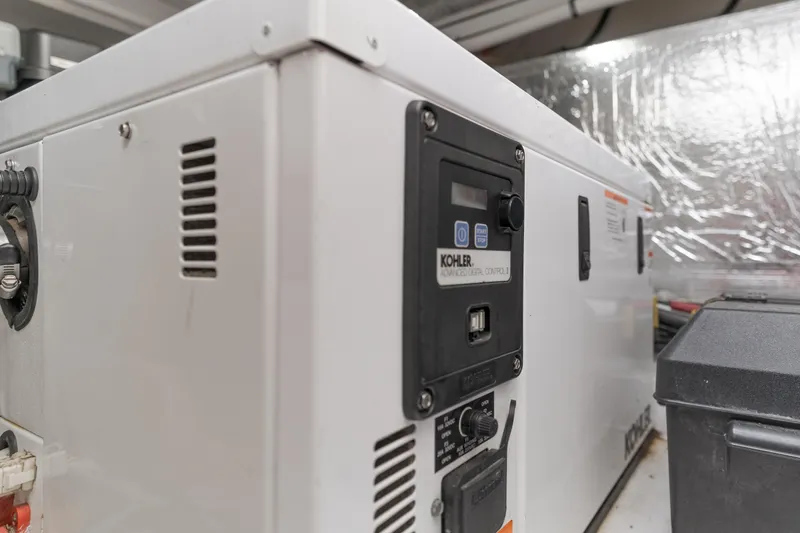 Slide: The Image of Kohler generator in 2017 Cruisers Yachts 39 Express Coupe engine room. - 46