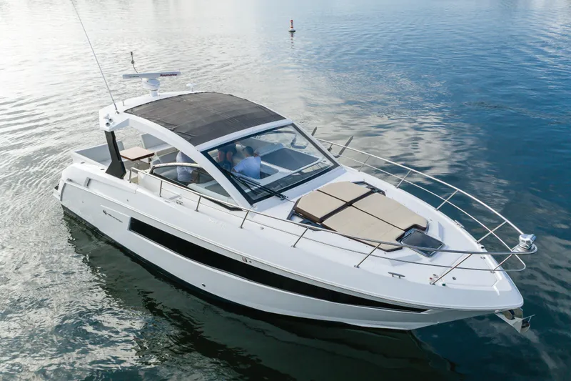 Slide: The Image of 2017 Cruisers Yachts 39 Express Coupe on calm water, showcasing sleek design and luxury features. - 7