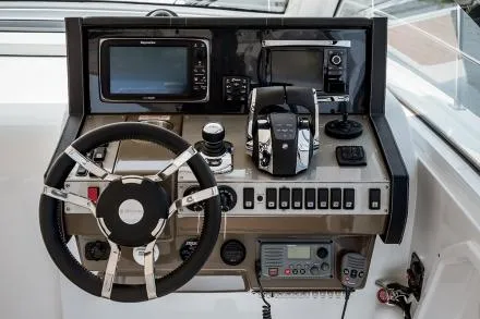 Slide: The Image of Manufacturer Provided Image: 2017 Cruisers Yachts 39 Express Coupe helm with steering wheel, navigation, and control systems. - 34
