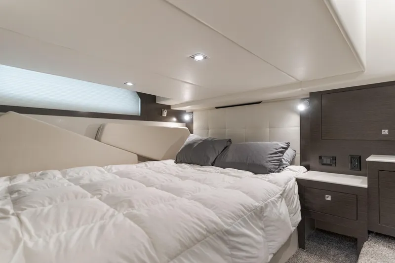 Slide: The Image of Luxurious cabin interior of 2017 Cruisers Yachts 39 Express Coupe with cozy bedding. - 42